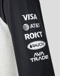 Close up of a black sleeve featuring sponsor logos including VISA AT&T ROKT RAUCH and AVA TRADE.