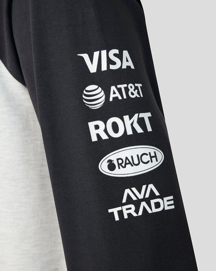Close up of a black sleeve featuring sponsor logos including VISA AT&T ROKT RAUCH and AVA TRADE.