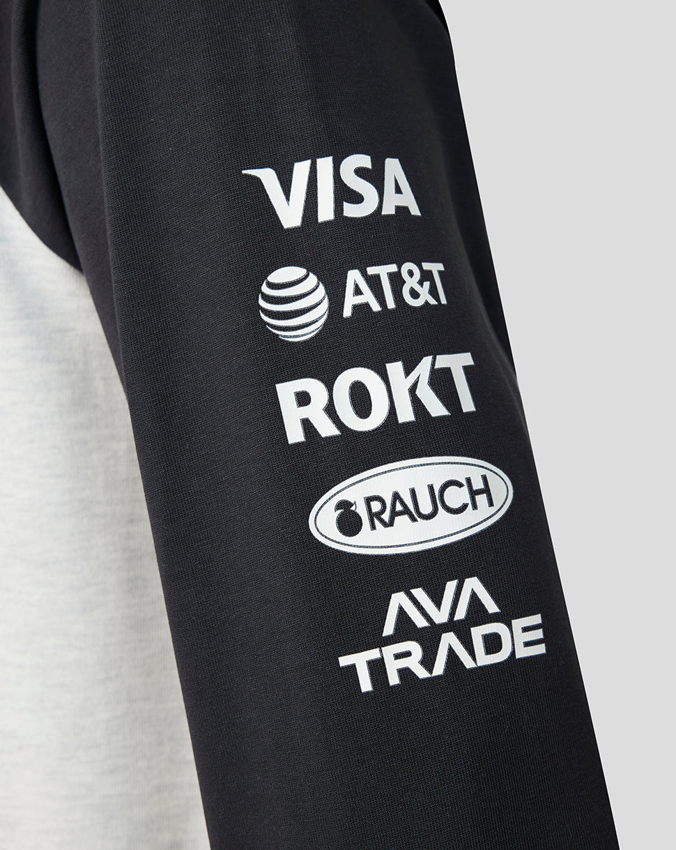 Close up of a black sleeve featuring sponsor logos including VISA AT&T ROKT RAUCH and AVA TRADE.