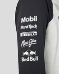 Black sleeve of a Raglan shirt featuring white sponsor logos Mobil Hard Rock Pirelli Maui Jim and Red Bull